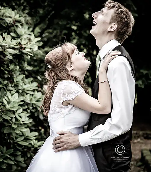 bride and groom burst into giggling while enjoying their wedding portraits at Hotel du Vin, Tunbridge Wells