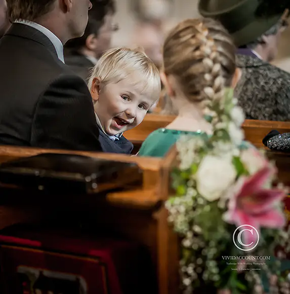 page boy distracted during exchanging of vows at Tunbridge Wells church service