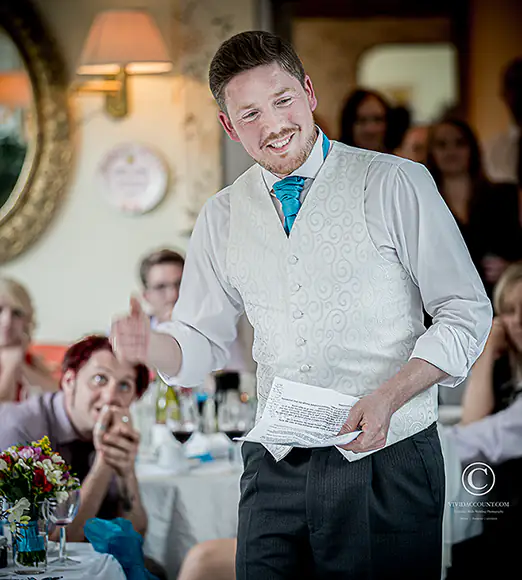 best man delivers hilarious Tunbridge Wells wedding speech as he walks around the guests seated in Powdermills near Tunbridge Wells