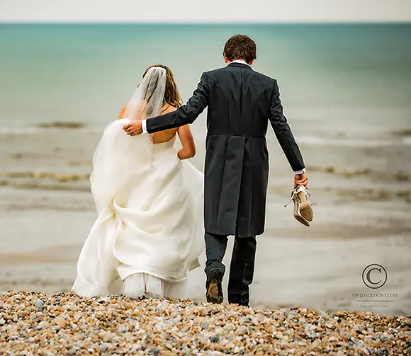 newly married Tunbridge Wells husband an wife take a private sussex beach wedding day walk