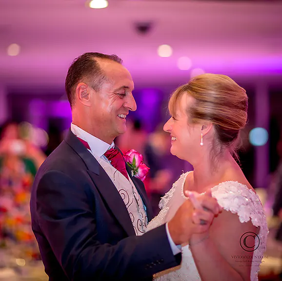 bride and groom take to the dance floor to enjoy their first dance together