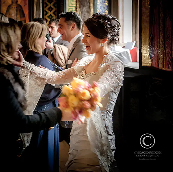 wedding guest being received and welcomed by their hosts before leaving the ceremony and moving to the Tunbridge Wells reception